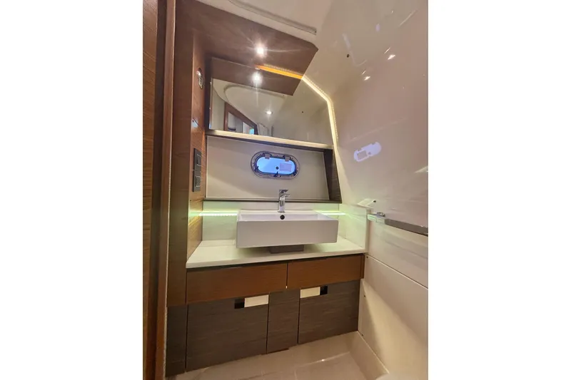 Slide: The Image of Luxurious bathroom interior of 2019 Tiara Sport 38 LS yacht with modern sink and lighting. - 26