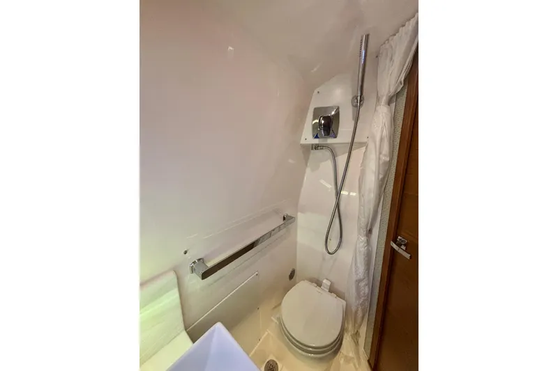 Slide: The Image of 2019 Tiara Sport 38 LS boat bathroom with shower and toilet. - 27