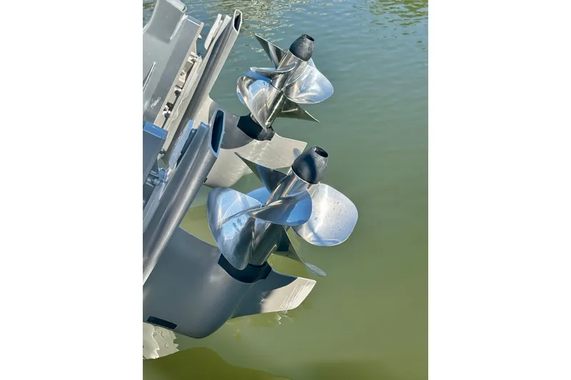 Slide: The Image of Propellers of a 2019 Tiara Sport 38 LS boat in water. - 32