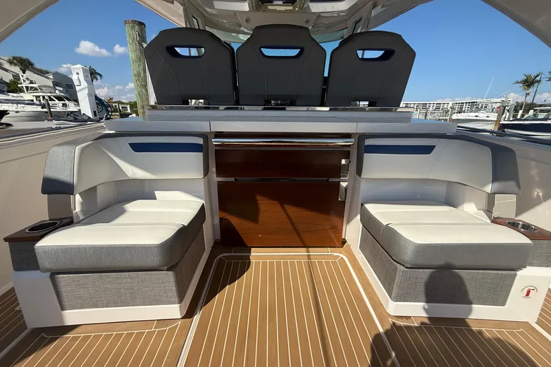 Slide: The Image of 2019 Tiara Sport 38 LS boat interior with luxurious seating and modern design. - 6