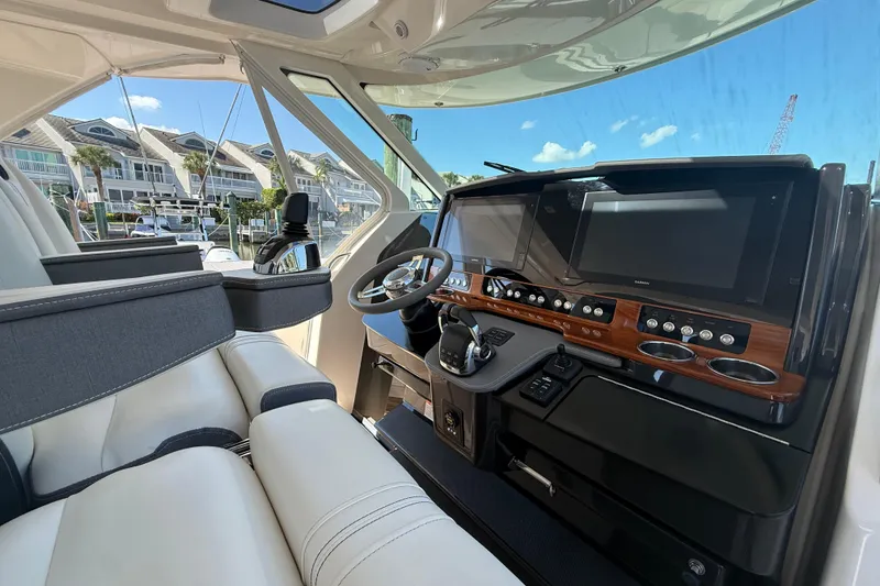 Slide: The Image of Interior of 2019 Tiara Sport 38 LS boat with modern dashboard and steering wheel. - 9