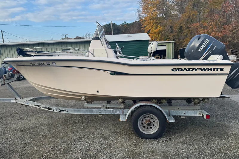 The Image of 2006 Grady-White Sportsman 180 boat on trailer, with Yamaha outboard motor. - 0