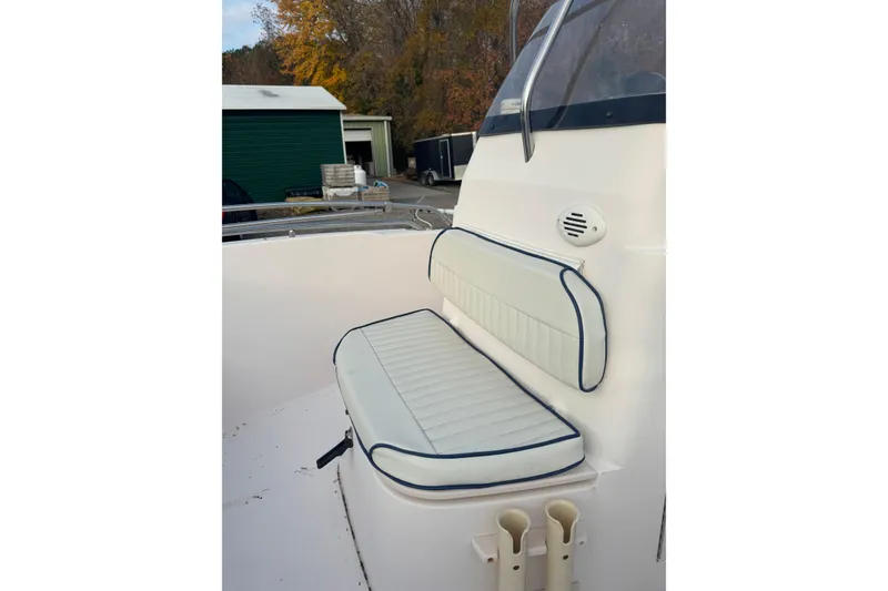Slide: The Image of 2006 Grady-White Sportsman 180 boat seat with white and blue cushions. - 4