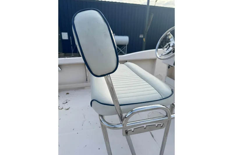 Slide: The Image of 2006 Grady-White Sportsman 180 boat seat with white and blue upholstery. - 7