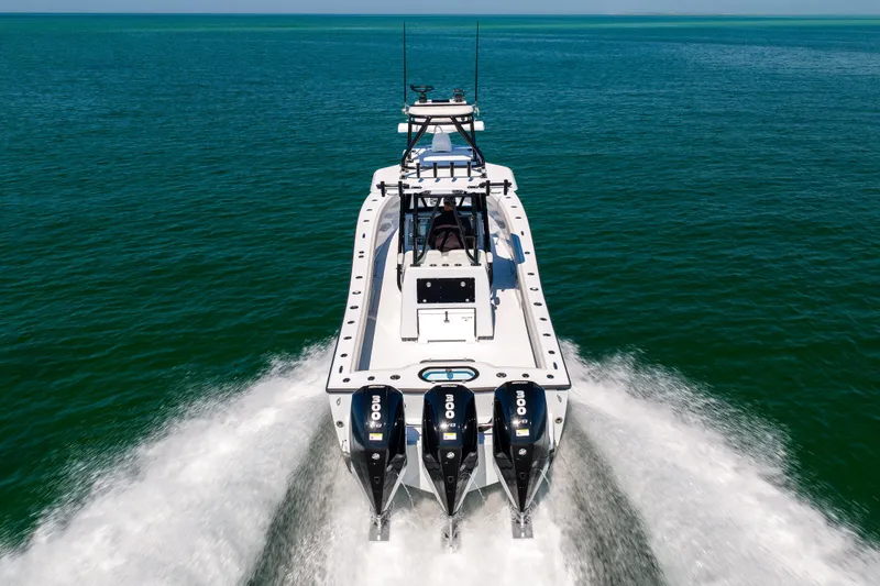 Slide: The Image of 2025 Conch 33 boat cruising on open water with powerful engines. - 19