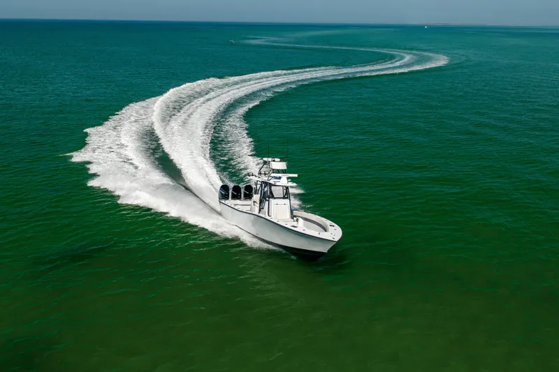 Slide: The Image of 2025 Conch 33 boat making a sharp turn on open sea. - 27