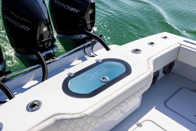 Slide: The Image of 2025 Conch 33 boat with Mercury engines on a sunny day. - 34