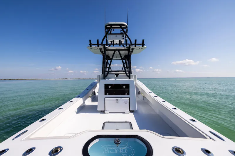 Slide: The Image of 2025 Conch 33 boat on calm sea under clear blue sky. - 38