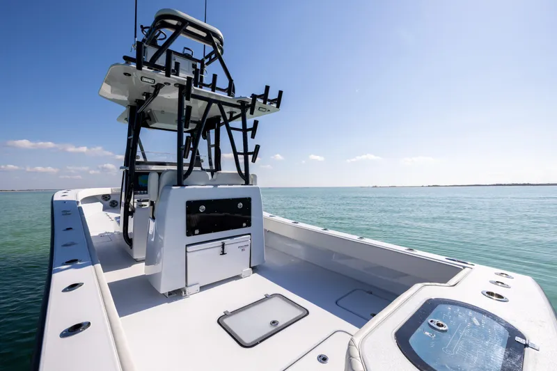 Slide: The Image of 2025 Conch 33 boat on calm ocean waters under clear blue sky. - 39