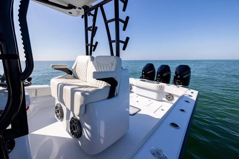 Slide: The Image of 2025 Conch 33 boat with triple Mercury engines on open sea. - 63