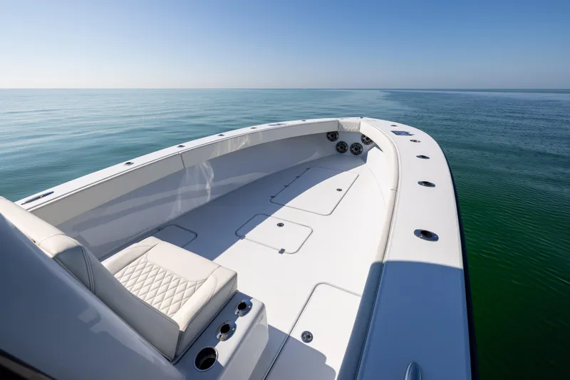 Slide: The Image of 2025 Conch 33 boat on calm sea, featuring sleek design and spacious deck. - 75