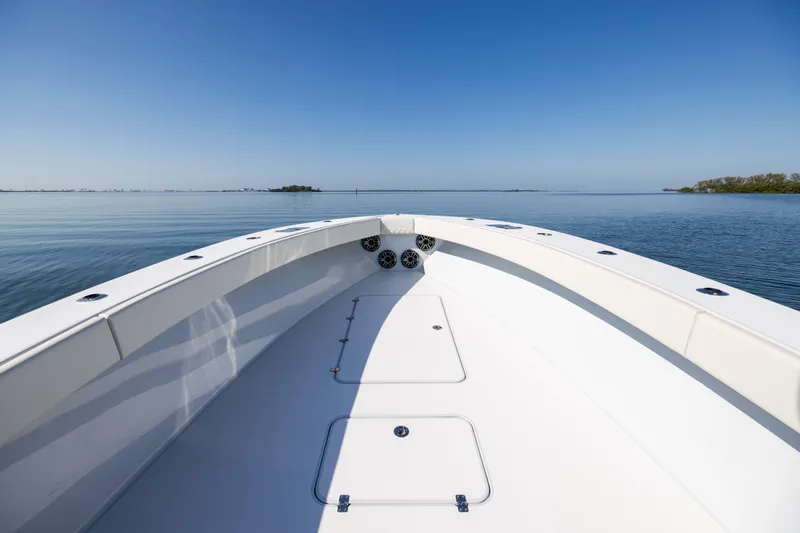Slide: The Image of 2025 Conch 33 boat on calm water under clear blue sky. - 77