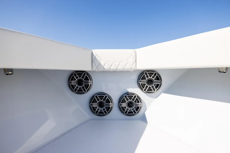 Slide: The Image of 2025 Conch 33 boat speakers and seating detail under clear blue sky. - 78
