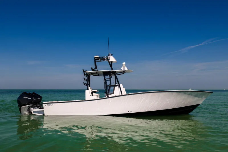 Slide: The Image of 2025 Conch 33 boat on calm sea under clear blue sky. - 8