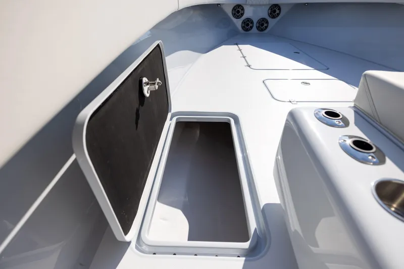 Slide: The Image of Open storage compartment on 2025 Conch 33 boat deck, showcasing sleek design and functionality. - 82