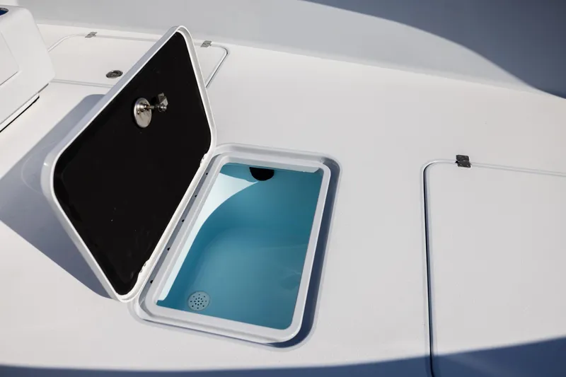 Slide: The Image of Open storage compartment on 2025 Conch 33 boat deck. - 83