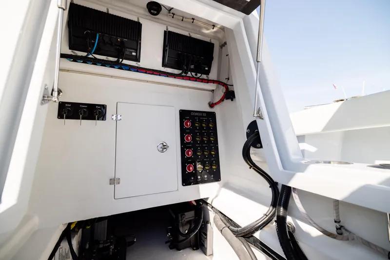 Slide: The Image of Interior view of 2025 Conch 33 boat's control panel and wiring. - 84