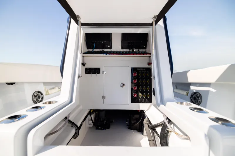Slide: The Image of Interior view of 2025 Conch 33 boat's control panel and storage area. - 85