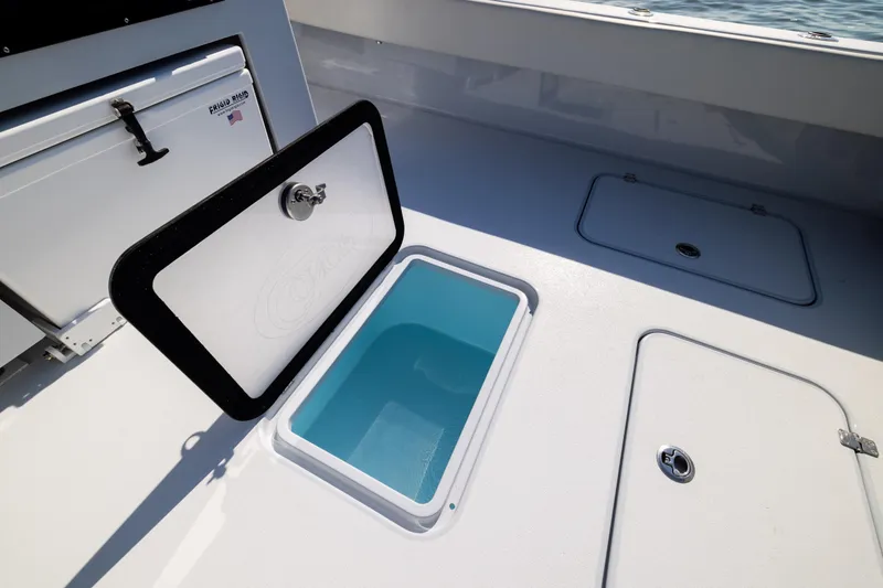 Slide: The Image of Open storage compartment on 2025 Conch 33 boat deck. - 87