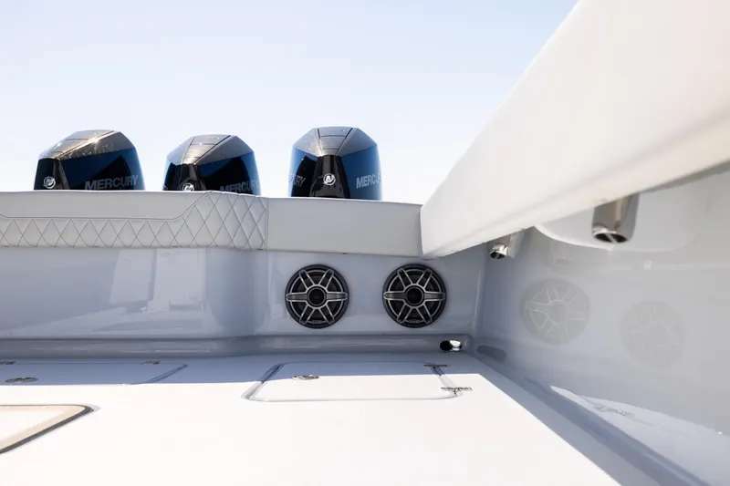 Slide: The Image of 2025 Conch 33 boat with Mercury engines and sleek interior design. - 90