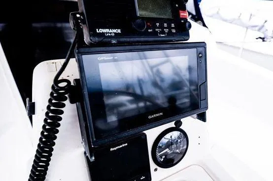 Slide: The Image of Navigation equipment on a 2001 Hunter 340 sailboat, featuring Garmin and Lowrance devices. - 12