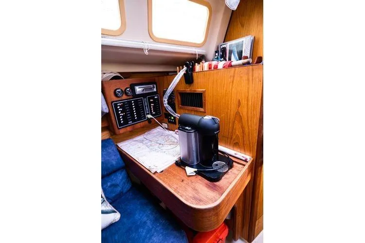 Slide: The Image of Cozy cabin interior of 2001 Hunter 340 sailboat with navigation station and coffee maker. - 20