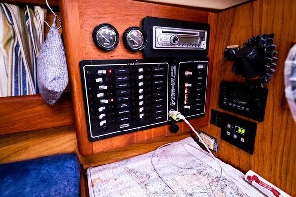 Slide: The Image of Electrical panel and navigation area inside a 2001 Hunter 340 sailboat cabin. - 21