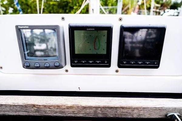 Slide: The Image of Control panel of a 2001 Hunter 340 sailboat with navigation displays. - 26
