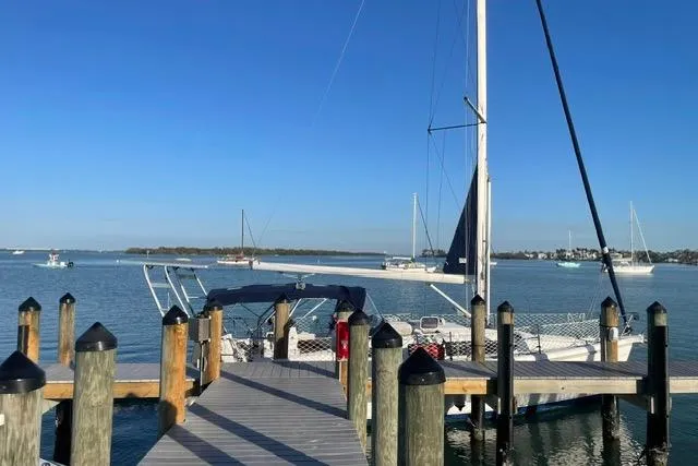 Slide: The Image of Sailboat docked at marina, clear blue sky, Hunter 340, 2001 model. - 33