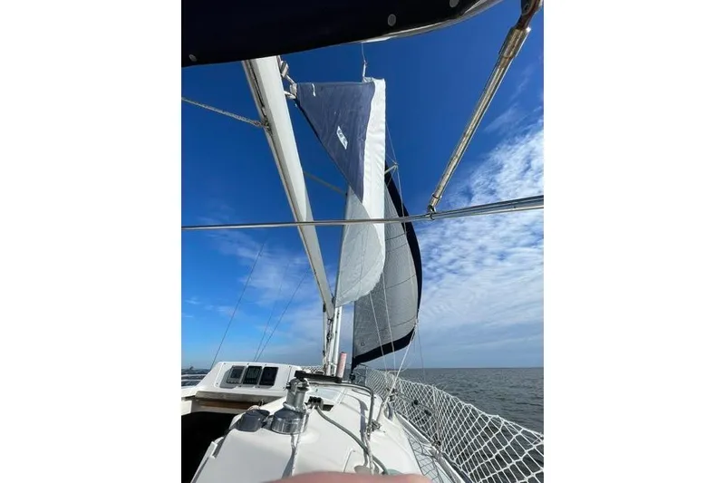 Slide: The Image of Sailing on a 2001 Hunter 340 yacht under clear blue skies. - 39