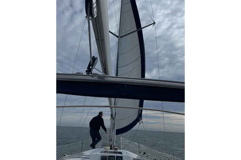 Slide: The Image of Sailing on a 2001 Hunter 340 yacht under cloudy skies. - 42