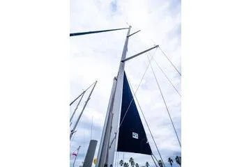 Slide: The Image of Sailboat mast and sails of a 2001 Hunter 340 against a cloudy sky. - 6