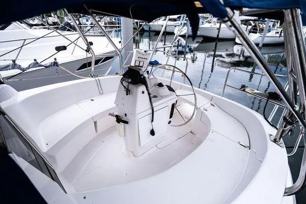 Slide: The Image of Cockpit of a 2001 Hunter 340 sailboat docked at a marina. - 9