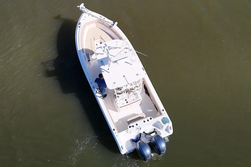 Slide: The Image of Aerial view of 2018 Sailfish 270 CC boat on calm water. - 10