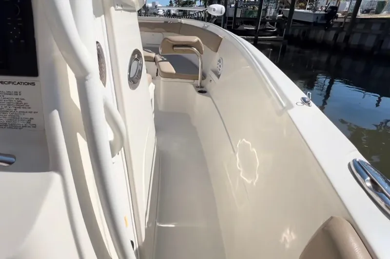 Slide: The Image of 2018 Sailfish 270 CC boat interior, featuring sleek design and comfortable seating. - 32