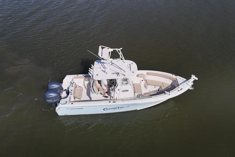 Slide: The Image of 2018 Sailfish 270 CC boat on water, aerial view, twin Yamaha engines. - 6
