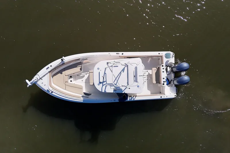 Slide: The Image of Overhead view of 2018 Sailfish 270 CC boat on water, featuring dual engines. - 8