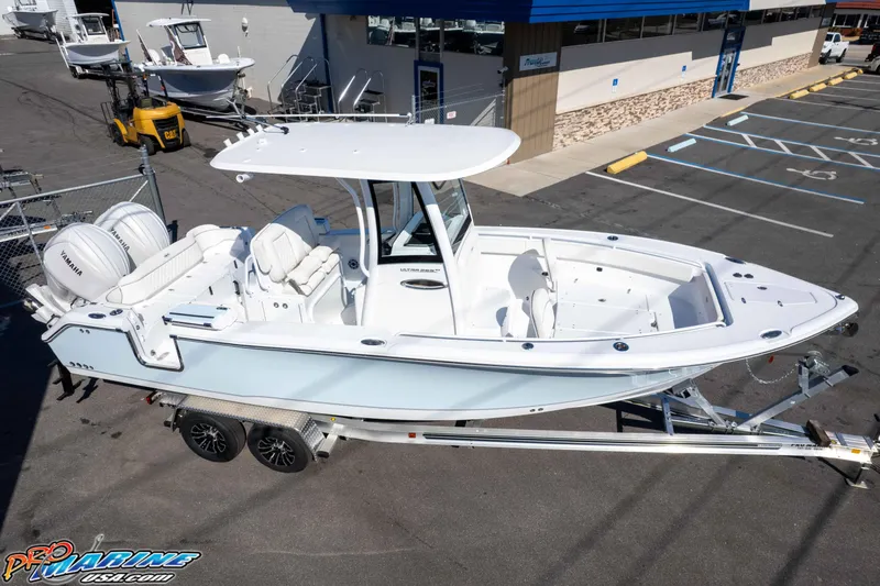 Slide: The Image of 2026 Sea Hunt Ultra 265 SE boat on trailer, parked in marina lot. - 10