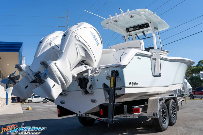 Slide: The Image of 2026 Sea Hunt Ultra 265 SE boat on trailer with dual Yamaha engines. - 17