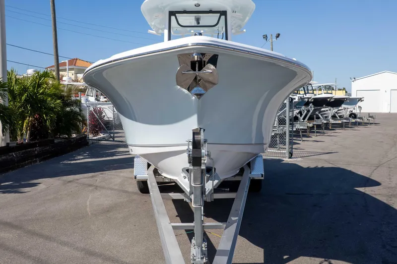 Slide: The Image of 2026 Sea Hunt Ultra 265 SE boat on trailer in a marina setting. - 2