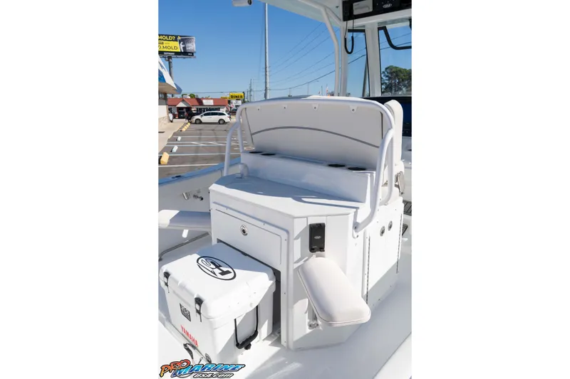 Slide: The Image of 2026 Sea Hunt Ultra 265 SE boat interior with seating and storage features. - 24