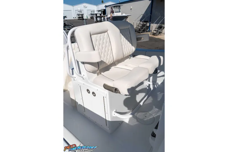 Slide: The Image of Luxurious seating on 2026 Sea Hunt Ultra 265 SE boat, featuring white cushioned design. - 30