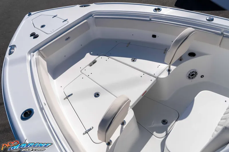 Slide: The Image of 2026 Sea Hunt Ultra 265 SE boat interior with seating and storage compartments. - 31