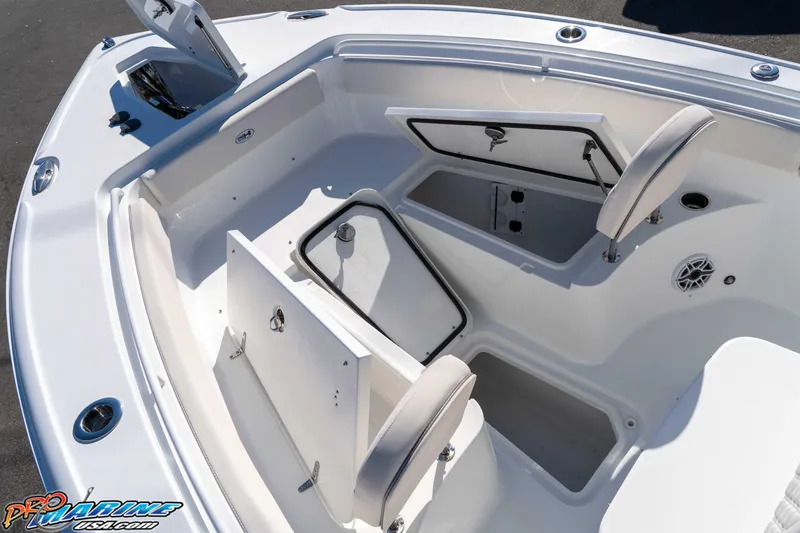 Slide: The Image of 2026 Sea Hunt Ultra 265 SE boat interior with open storage compartments. - 32