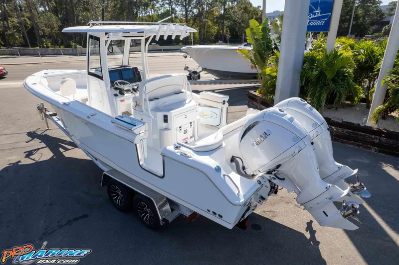 Slide: The Image of 2026 Sea Hunt Ultra 265 SE boat on trailer, featuring dual outboard engines. - 7