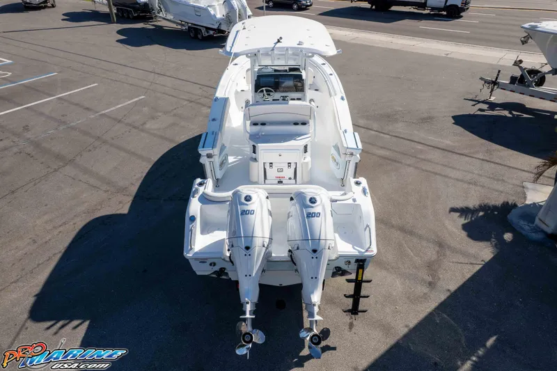 Slide: The Image of 2026 Sea Hunt Ultra 265 SE boat with dual 200 horsepower engines, aerial view. - 8