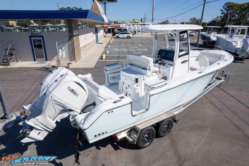 Slide: The Image of 2026 Sea Hunt Ultra 265 SE boat with dual Yamaha engines on a trailer. - 9