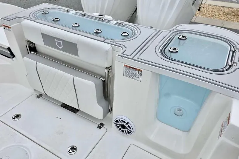 Slide: The Image of 2026 Sea Fox 288 Commander boat interior with seating and storage compartments. - 11