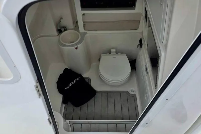 Slide: The Image of Interior of 2026 Sea Fox 288 Commander boat bathroom with toilet and sink. - 16
