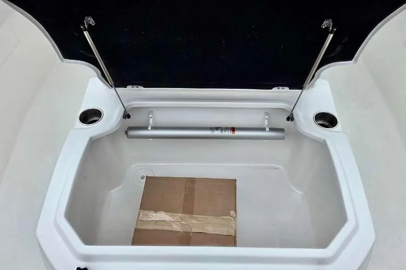 Slide: The Image of Open storage compartment in 2026 Sea Fox 288 Commander boat with cardboard box inside. - 20